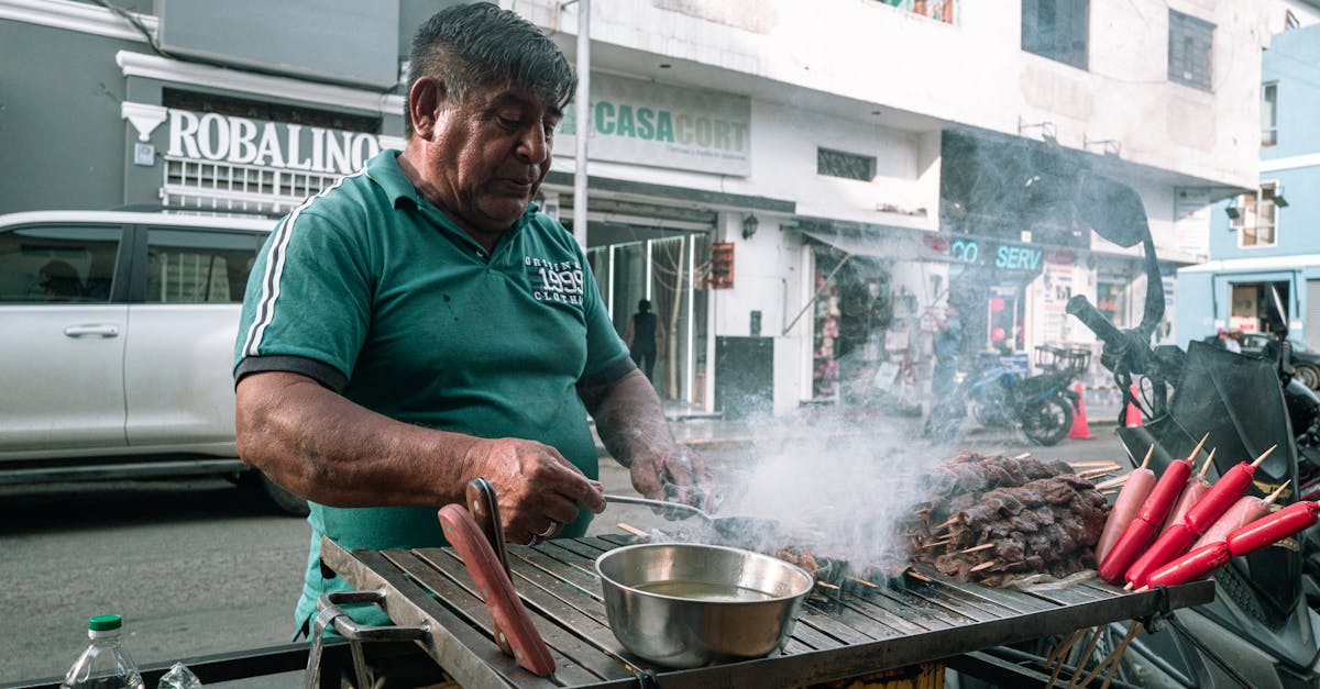 Lima street cart at dusk grilling anticuchos over charcoal, with skewers of beef heart, boiled potato halves, and corn ready to serve